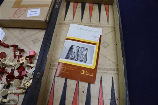 A Backgammon / chess board with stained ivory pieces